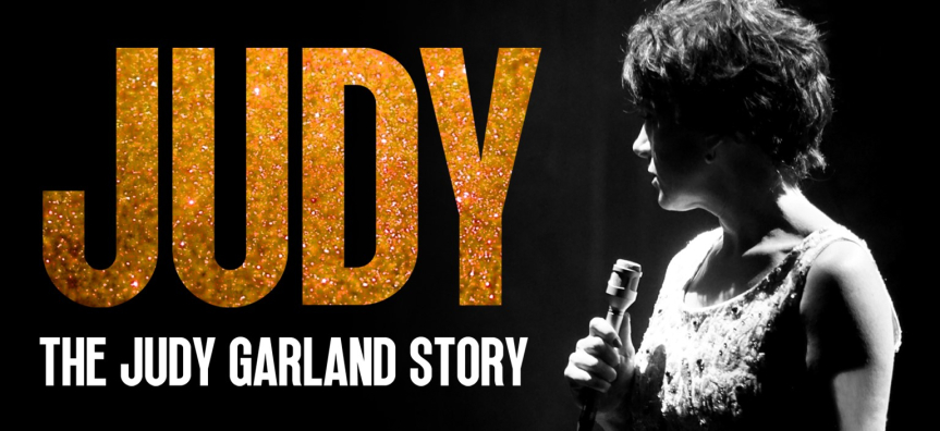 A black and white photo of a singer with short hair holding a microphone. In gold glittery font is the word JUDY and in smaller font 'The Judy Garland Story'