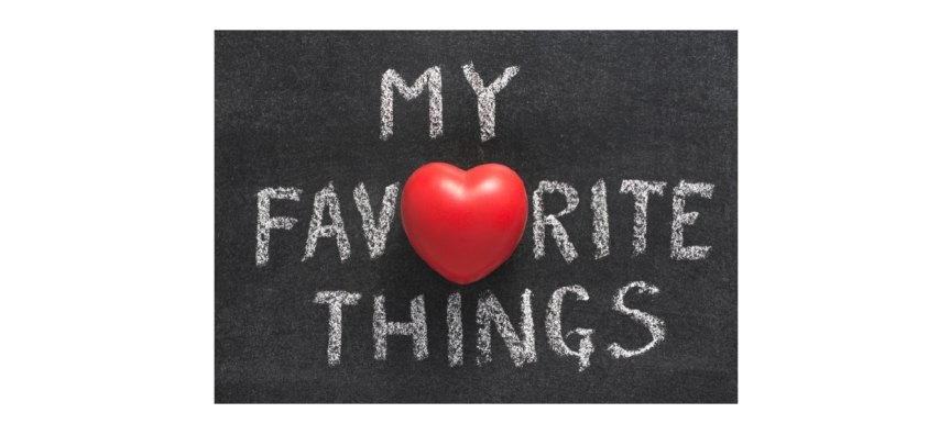 The words My Favourite Things are written on a chalkboard with a red apple in the middle of the text.