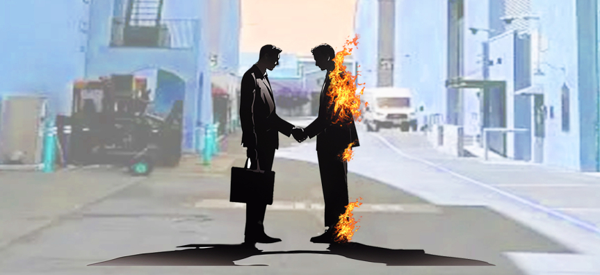 Silhouette of two men shaking hands and the one on the left is on fire