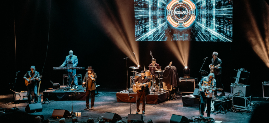A band plays underneath an ELO banner