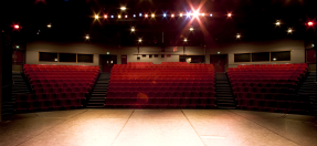 A photo of the inside of Glen Street Theatre, from the stage, looking out into the empty theatre