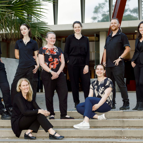 Image of Glen Street Theatre staff posed on the steps in front of the theatre